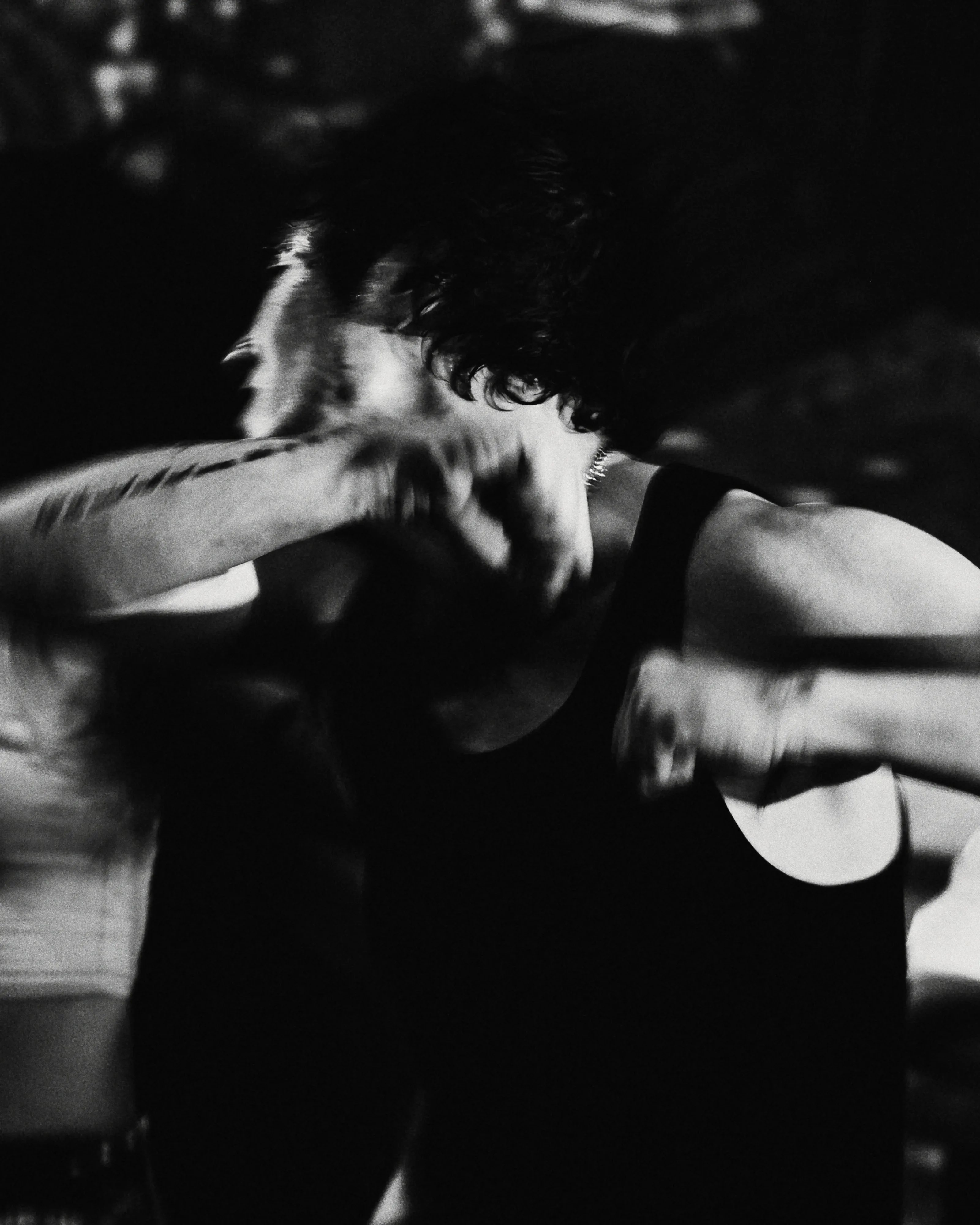 In grainy, high-contrast black and white